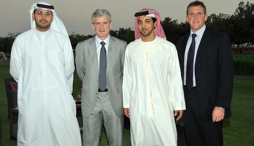 In this undated picture made available Wednesday, Nov. 12, 2008 and provided by Manchester City FC., shows Manchester City manager Mark Hughes, second from left, with Manchester City Chairman Khaldoon ...