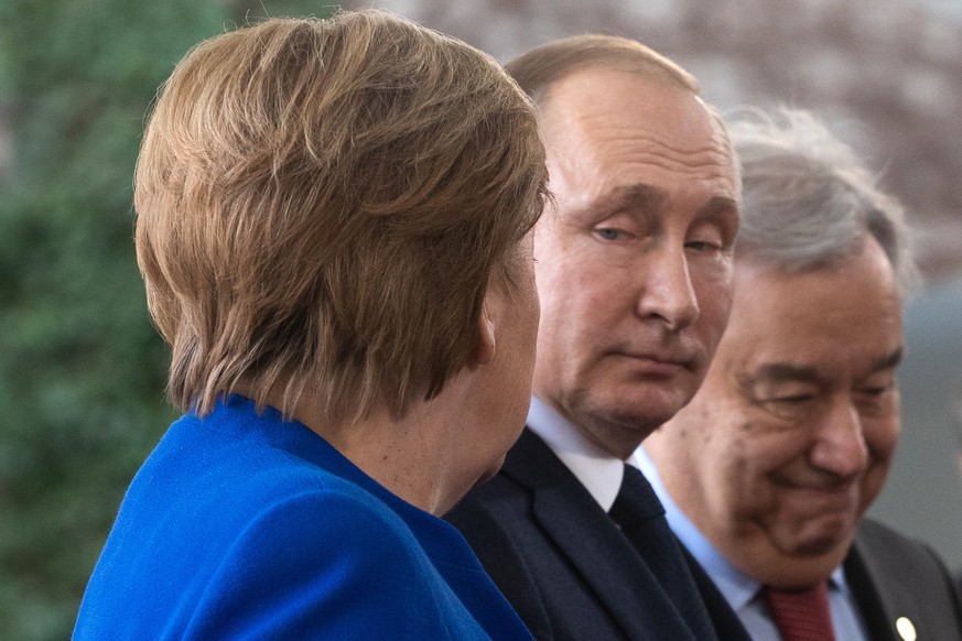 epa08646589 (FILE) - German Chancellor Angela Merkel (L) and Russian President Vladimir Putin during the International Libya Conference in Berlin, Germany, 19 January 2020 (reissued 04 September 2020) ...