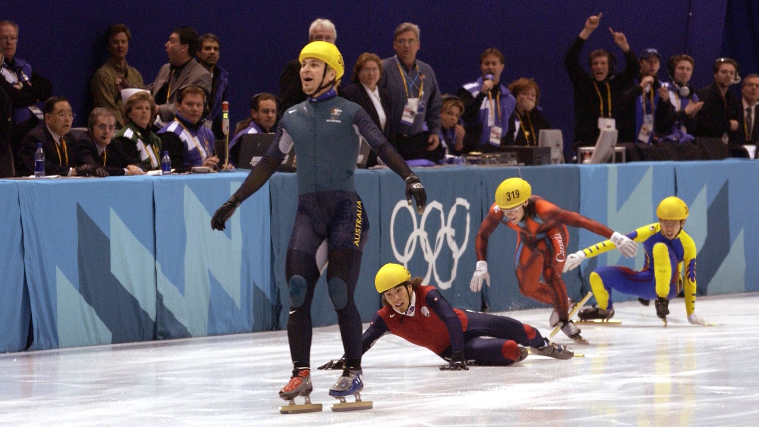 16 Feb 2002: Australia&#039;s first ever Winter Gold medal winner Steven Bradbury crosses the line while America&#039;s Apolo Anton Ohno scrambles for the line to claim second place after the men&#039 ...