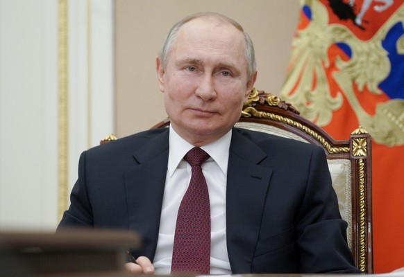 epa09082231 Russian President Vladimir Putin attends a meeting with public representatives of the Republic of Crimea and Sevastopol on the 7th anniversary of the referendum on the state status of the  ...