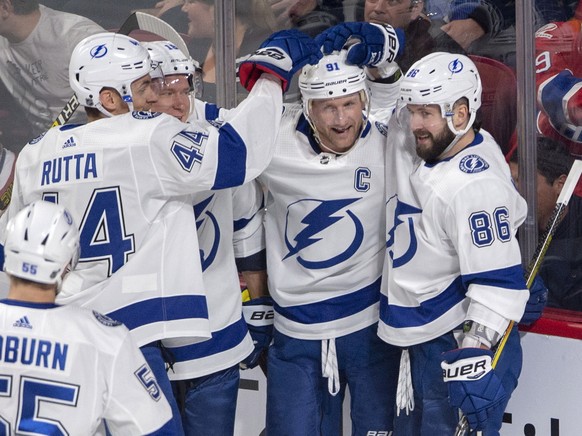 Tampa Bay Lightning center Steven Stamkos, second from right, celebrates with teammates after scoring the first goal during the first period of an NHL hockey game against the Montreal Canadiens, Tuesd ...