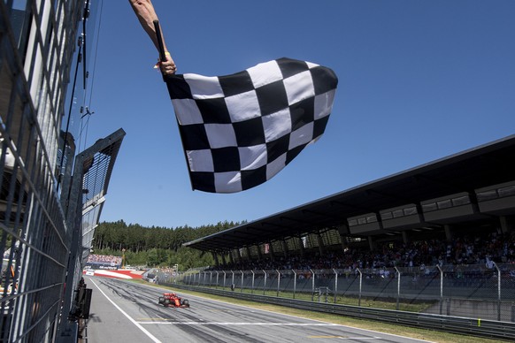 epa08386135 (FILE) - Monaco&#039;s Formula One driver Charles Leclerc of Scuderia Ferrari passes the finish line with checkered flag during the Austrian Formula One GP at the Red Bull Ring circuit in  ...