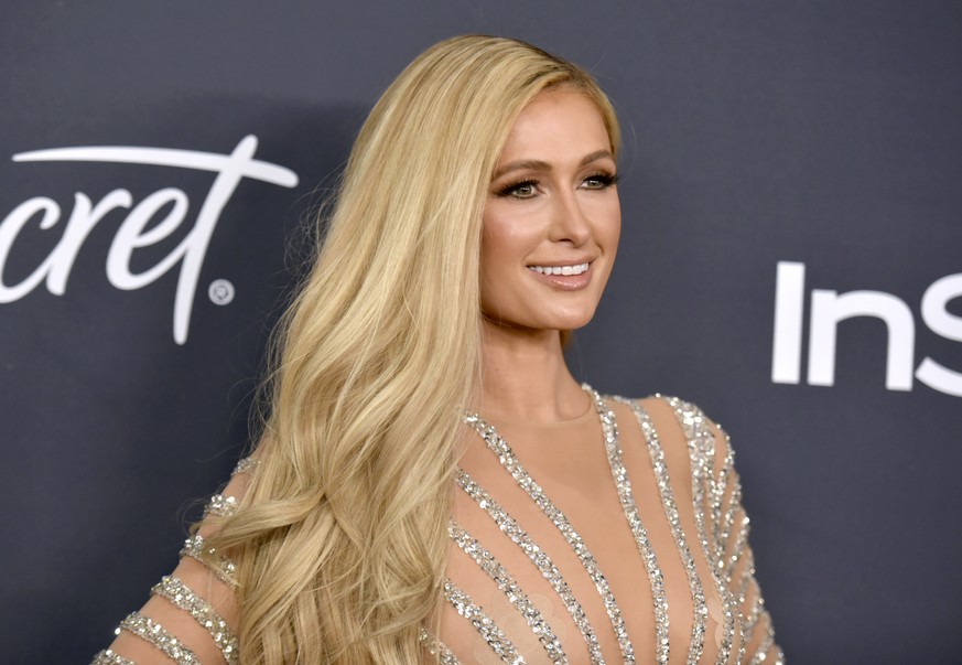 FILE - Paris Hilton arrives at the InStyle and Warner Bros. Golden Globes afterparty on Jan. 5, 2020, in Beverly Hills, Calif. Hilton announced her engagement to entrepreneur Carter Reum in her social ...