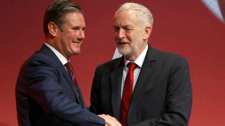 epa08342489 (FILE) - Britain&#039;s opposition Labour Party then Spokesperson for Exiting the EU, Keir Starmer (L) is congratulated following his speech by then party leader Jeremy Corbyn (R) at the L ...
