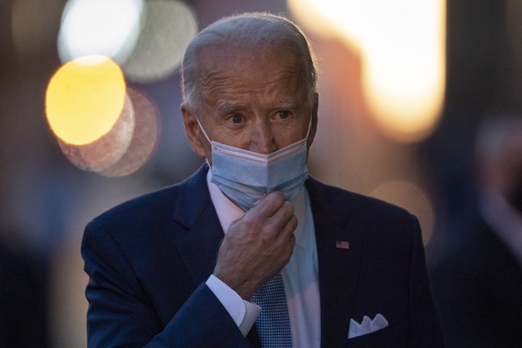 President-elect Joe Biden adjusts his face mask as she walks to speak to the media as he leaves The Queen theater, Tuesday, Nov. 24, 2020, in Wilmington, Del. (AP Photo/Carolyn Kaster)
Joe Biden