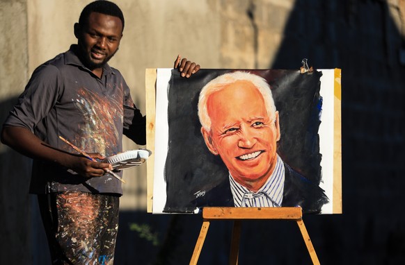 epa08810373 Kenyan artist Joseph Njoroge, also known by his artist name &#039;Josey Arts,&#039; poses for a picture after finishing a portrait of US President-elect Joe Biden in Ruiru, Kiambu, Kenya,  ...