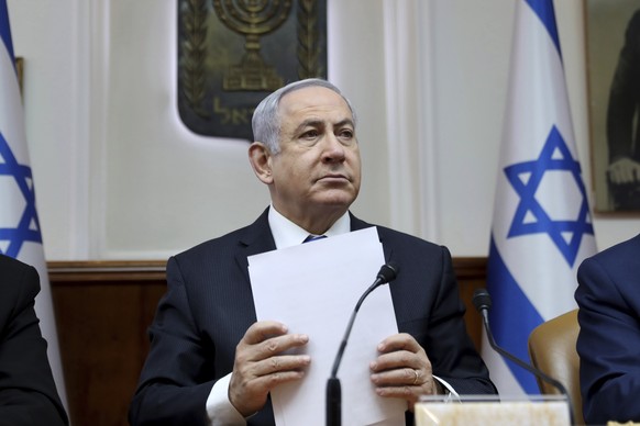 FILE - In this Feb. 16, 2020, file, photo, Israeli Prime Minister Benjamin Netanyahu chairs the weekly cabinet meeting, in Jerusalem. Several thousand Israelis have demonstrated Saturday, April 25, 20 ...