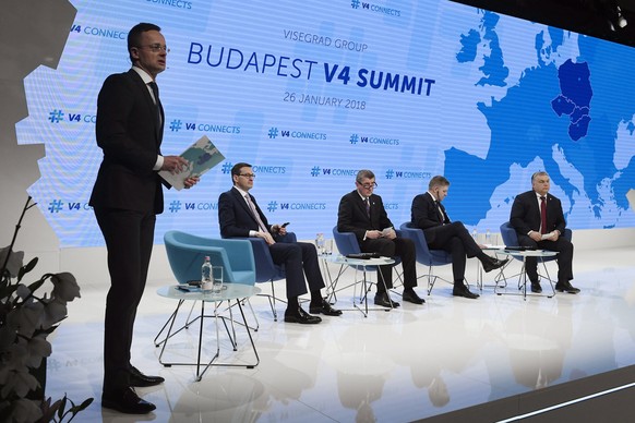 From left, Hungarian Minister of Foreign Affairs and Trade Peter Szijjarto as moderator leads the panel discussion of Polish Premier Mateusz Morawiecki, interim Czech Prime Minister Andrej Babis, Slov ...