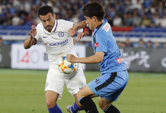 Chelsea&#039;s Pedro, left, and Frontale&#039;s Kyohei Noborizato, right, compete the ball during a soccer match between Chelsea FC and Kawasaki Frontale in Yokohama Friday, July 19, 2019. (AP Photo/E ...