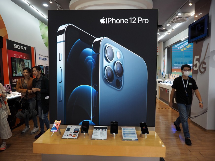 epa08784052 (FILE) - A sign advertising iPhone 12 Pro in a mobile store in Taipei, Taiwan, 23 October 2020 (reissued 29 October 2020). Apple is to publish their fourth fiscal quarter 2020 results on 2 ...