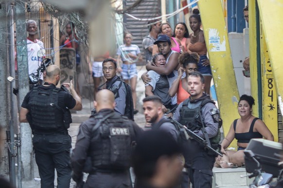 epa09181893 Members of the Police carry out a police operation against a gang of drug traffickers, in the Jacarezinho favela of Rio de Janeiro, Brazil, 06 May 2021. At least 25 people died, including  ...