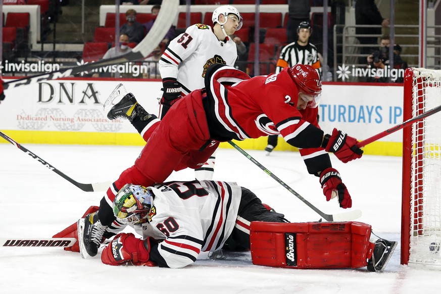Carolina Hurricanes&#039; Nino Niederreiter (21) collides with Chicago Blackhawks goaltender Collin Delia (60) after scoring a goal during the second period of an NHL hockey game in Raleigh, N.C., Tue ...