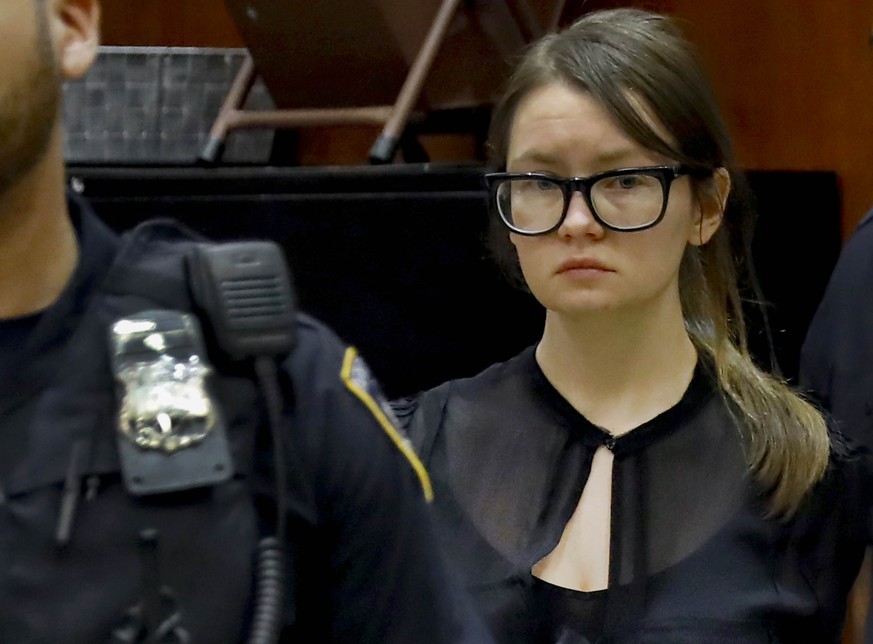 FILE - In this Thursday April 4, 2019, file photo Anna Sorokin is escorted into a courtroom after a recess in her trial at New York State Supreme Court in New York. U.S. immigration authorities said T ...