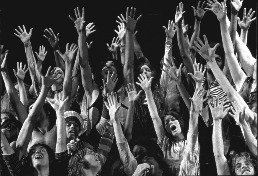 The entire cast of the stage musical Hair with their arms in the air. (Photo by Ray Fisher/The LIFE Images Collection via Getty Images/Getty Images)