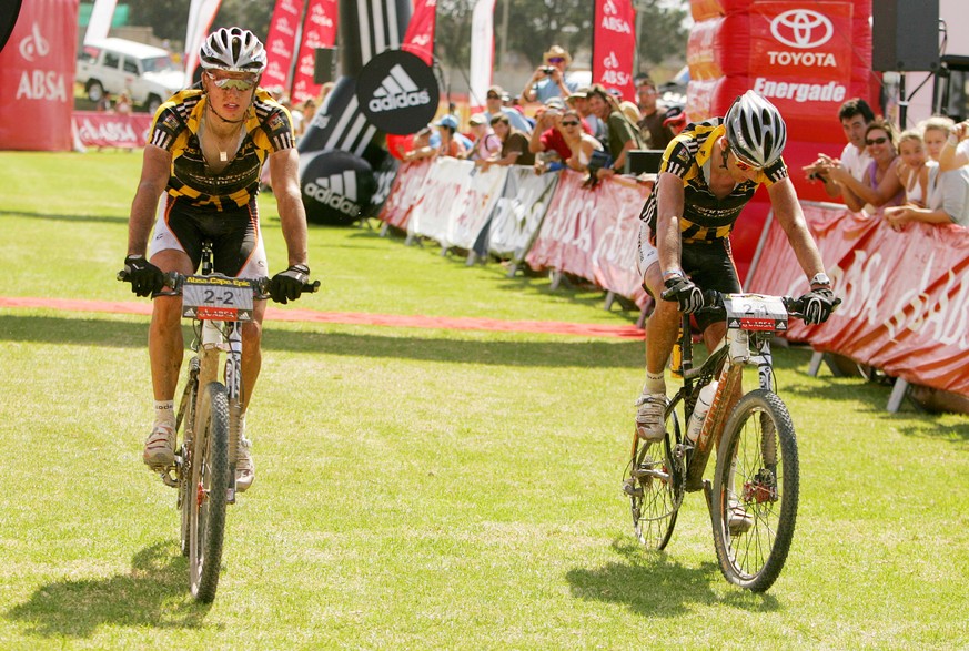 WESTERN CAPE, SOUTH AFRICA - 2 April 2008, Roel Paulissen &amp; Jakob Fuglsang of Canondale Vredenstein finish stage five of the 2008 Absa Cape Epic Mountain Bike stage race from Swellendam Primary Sc ...