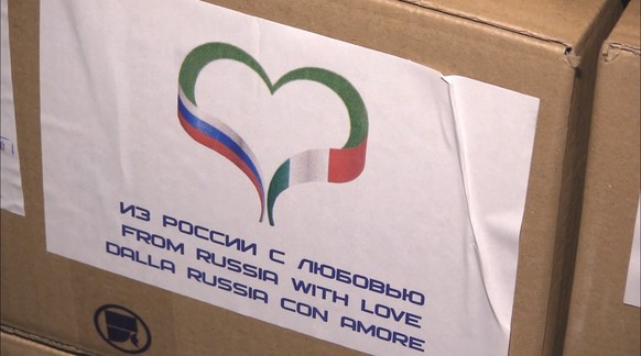 epa08320863 A still image from a handout video footage release 25 March 2020 by the press service of the Russian defence Ministry shows an inscription &#039;From Russia With Love&#039; visible on a bo ...