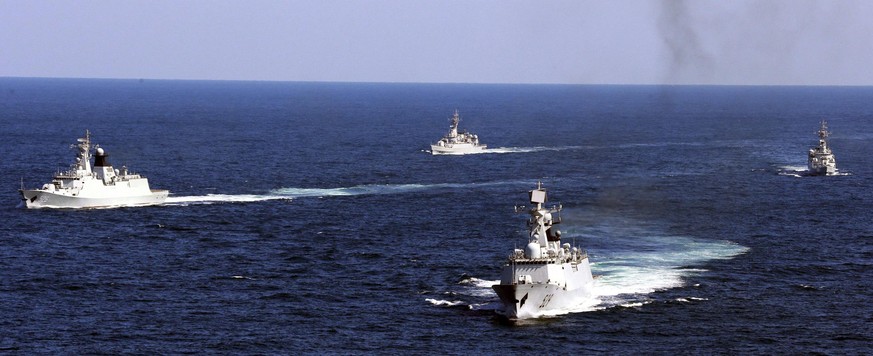 FILE - In this Oct. 19, 2012, file photo, Chinese navy vessels take part in a drill in the waters off Zhoushan in east China&#039;s Zhejiang province. China says it will increase its defense spending  ...