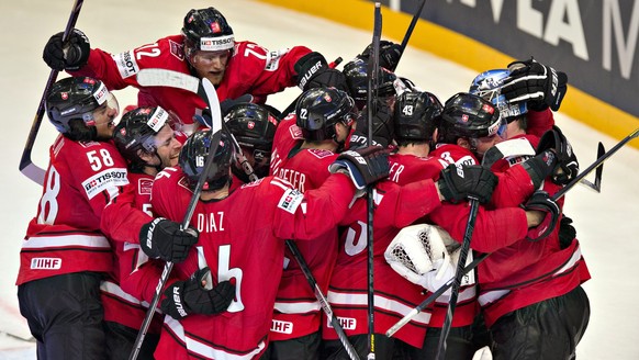 Switzerland celebrates after beating the United States 3-0 in a semifinal game Saturday, May 18, 2013 at the world hockey championships in Stockholm, Sweden. (AP Photo/The Canadian Press, Jacques Bois ...