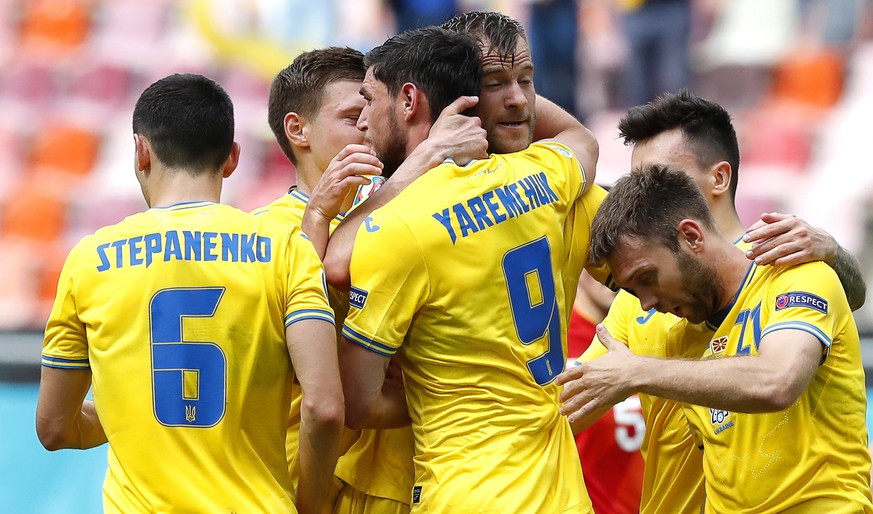 epa09279556 Roman Yaremchuk (C) of Ukraine celebrates with teammates after scoring the 2-0 lead during the UEFA EURO 2020 group C preliminary round soccer match between Ukraine and North Macedonia in  ...