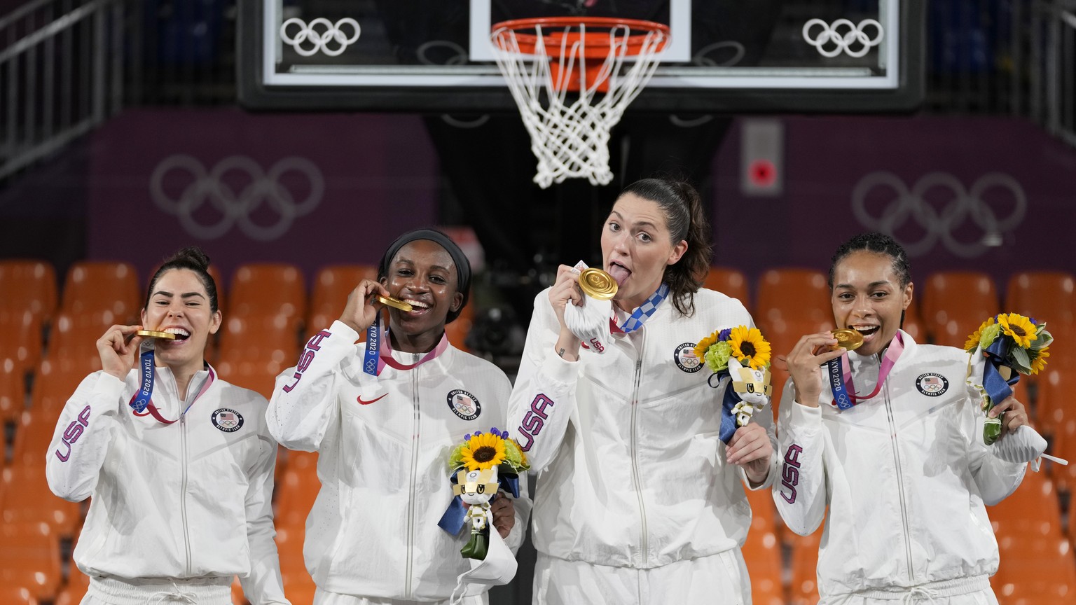 Members of team United States, from left to right, Kelsey Plum, Jacquelyn Young, Stefanie Dolson and Allisha Gray pose with their gold medals during the awards ceremony for women&#039;s 3-on-3 basketb ...