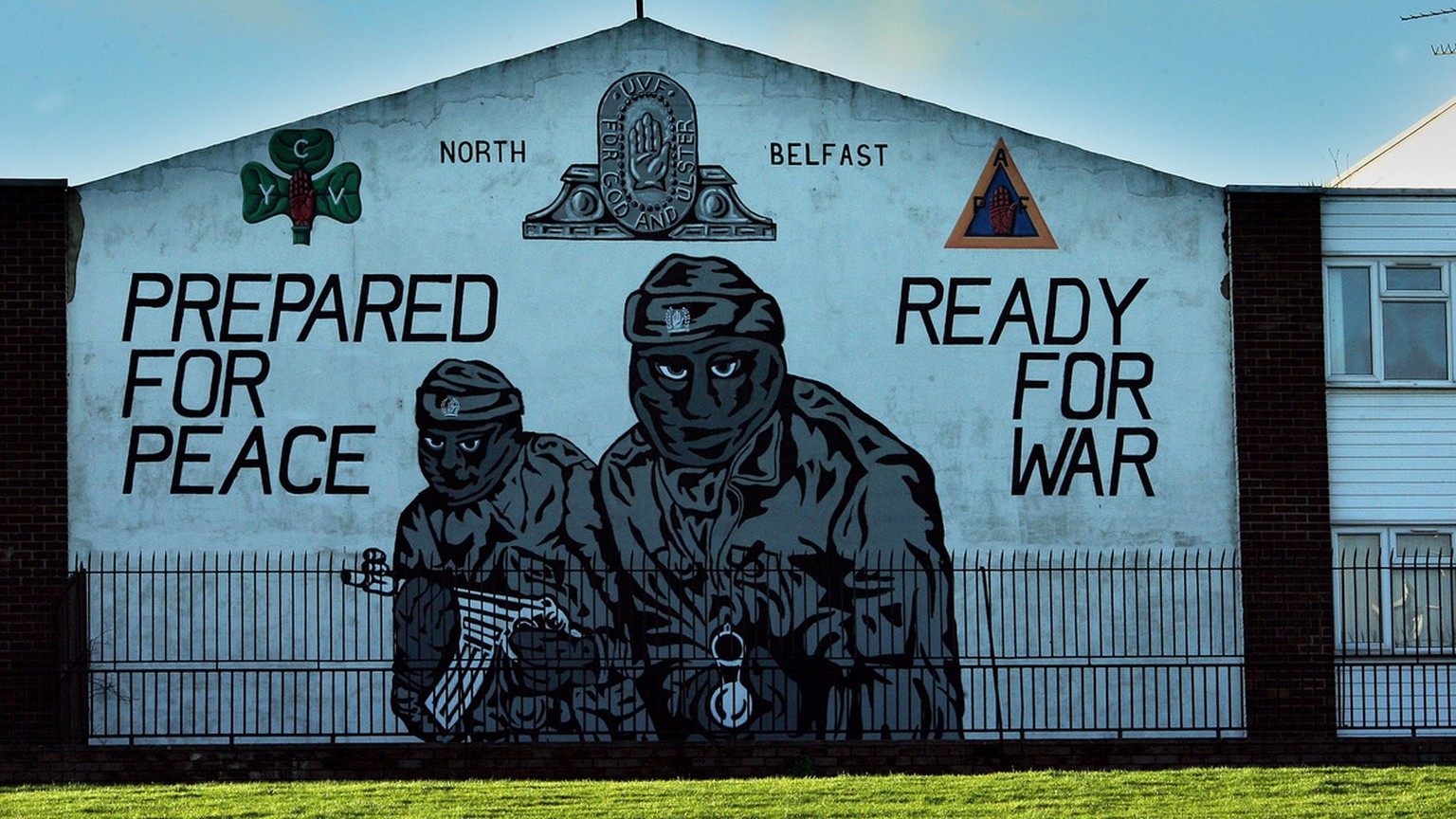 An Ulster Volunteer Force (UVF) mural is seen in north Belfast, Northern Ireland, Monday Jan. 22, 2007. An investigation into collusion between Belfast police and Protestant outlaws has found damning  ...