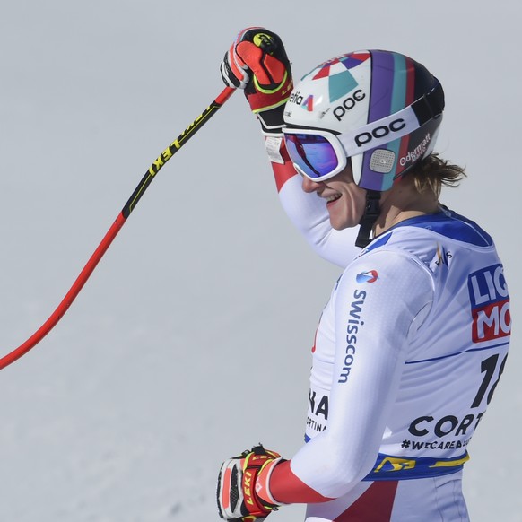 Switzerland&#039;s Marco Odermatt waves after completing the men&#039;s downhill, at the alpine ski World Championships in Cortina d&#039;Ampezzo, Italy, Sunday, Feb.14, 2021. (AP Photo/Marco Tacca)