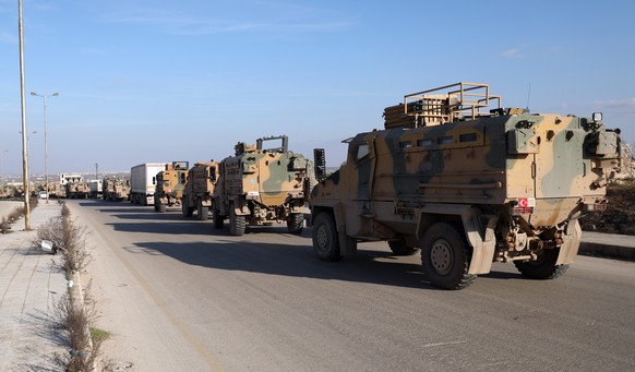 epa08230701 A Turkish military convoy moves east of Idlib, Syria, 20 February 2020. Turkish President Recep Tayyip Erdogan has said it is &#039;only a matter of time&#039; before it launches an operat ...