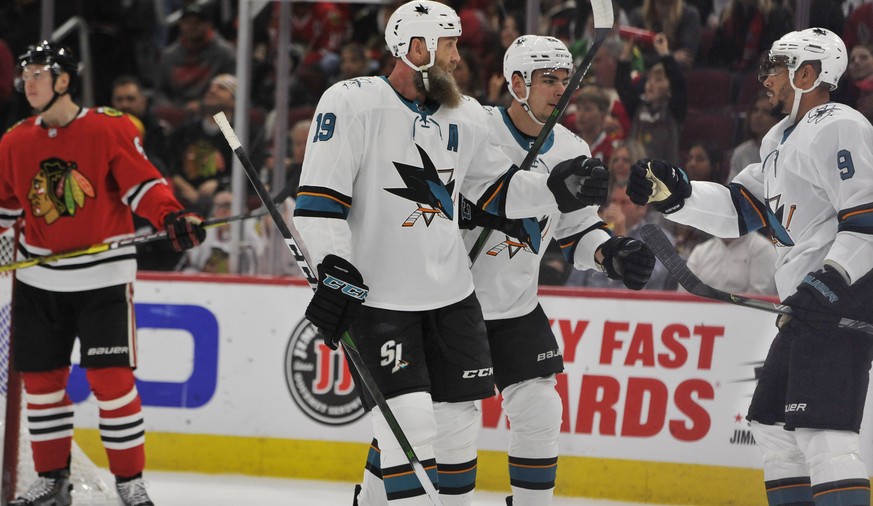 San Jose Sharks&#039; Evander Kane (9) celebrates with teammates Joe Thornton (19) and Timo Meier (28) of the Czech Republic, after scoring a goal during the first period of an NHL hockey game against ...