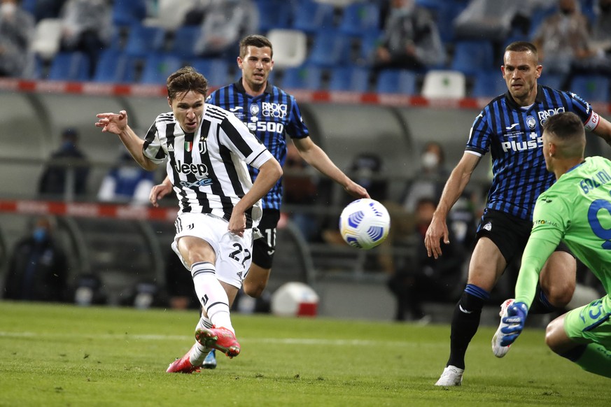 Juventus&#039; Federico Chiesa kicks the ball the ball during the Italian Cup soccer final match between Atalanta and Juventus at the Mapei Stadium in Reggio Emilia, Italy, Wednesday, May 19, 2021. (A ...