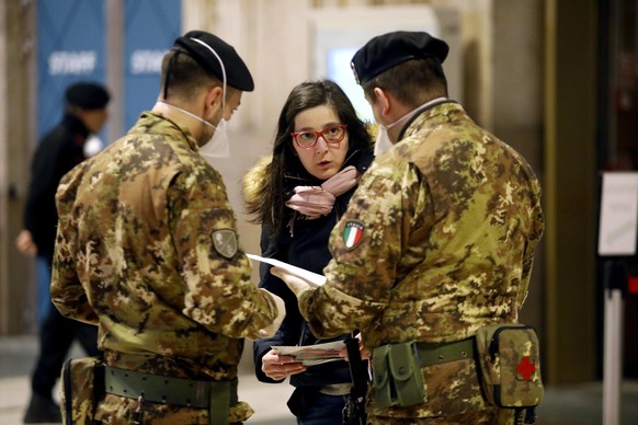 epa08310516 Police and military checks at Central station during the coronavirus emergency lockdown, in Milan, Italy, 20 March 2020. Italy declared state of emergency lockdown against the Covid-19 Cor ...