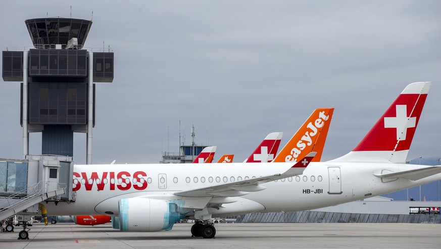 epa08331752 A large number of Swiss International Air Lines aircrafts and easyJet aircrafts are parked on the tarmac of the Geneve Aeroport, in Geneva, Switzerland, 30 March 2020. EasyJet, a British l ...