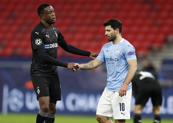 Moenchengladbach&#039;s Denis Zakaria, left, and Manchester City&#039;s Sergio Aguero shake hands following the Champions League round of 16 second leg soccer match between Manchester City and Borussi ...