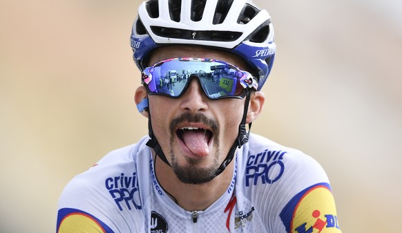 France&#039;s Julian Alaphilippe grimaces when crossing the finish line of stage 17 of the Tour de France cycling race over 107 kilometers (105.6 miles) from Grenoble to Meribel Col de la Loze, France ...