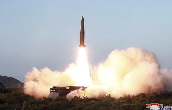 FILE - This July 25, 2019, file photo provided by the North Korean government shows a test of a missile launch in North Korea. North Korea on Friday, Aug. 9, 2019 said that its rubber-stamp parliament ...