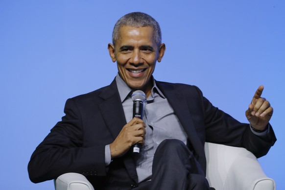 FILE - Former U.S. President Barack Obama gesture as he attends the &quot;values-based leadership&quot; during a plenary session of the Gathering of Rising Leaders in the Asia Pacific, organized by th ...
