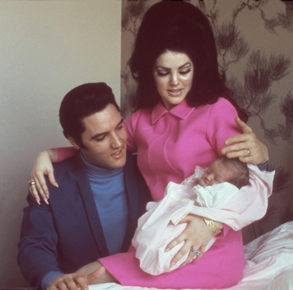 MEMPHIS, TN - FEBRUARY 5: Rock and roll singer Elvis Presley with his wife Priscilla Beaulieu Presley and their 4 day old daughter Lisa Marie Presley on February 5, 1968 in Memphis, Tennessee. (Photo  ...