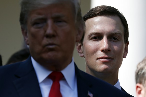 FILE - In this Oct. 1, 2018, file photo, White House senior adviser Jared Kushner, right, stands behind President Donald Trump, left, during a news conference as he announces a revamped North American ...