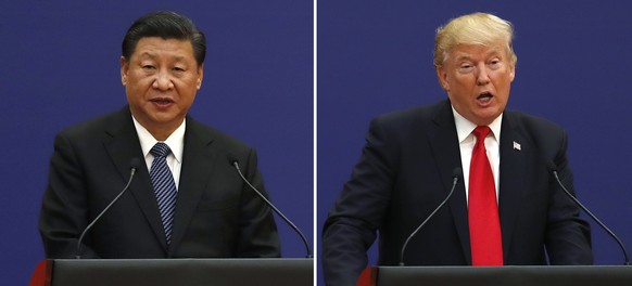 In this combination of Nov. 9, 2017 photos, U.S. President Donald Trump, right, and Chinese President Xi Jinping speak during a business event at the Great Hall of the People in Beijing. The brewing C ...