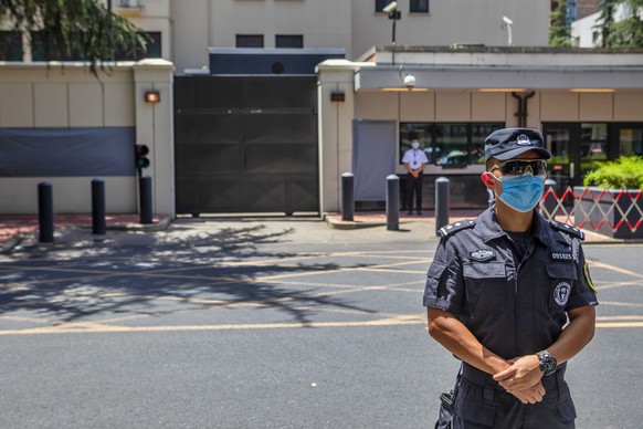 epaselect epa08568161 A police officer guards the area surrounding the building of the former US consulate in Chengdu, Sichuan province capitol, China, 27 July 2020. The US Consulate General in the so ...