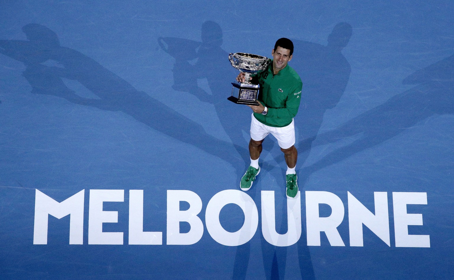 FILE - In this Feb. 3, 2020, file photo, Serbia&#039;s Novak Djokovic holds the Norman Brookes Challenge Cup after defeating Austria&#039;s Dominic Thiem in the men&#039;s singles final of the Austral ...