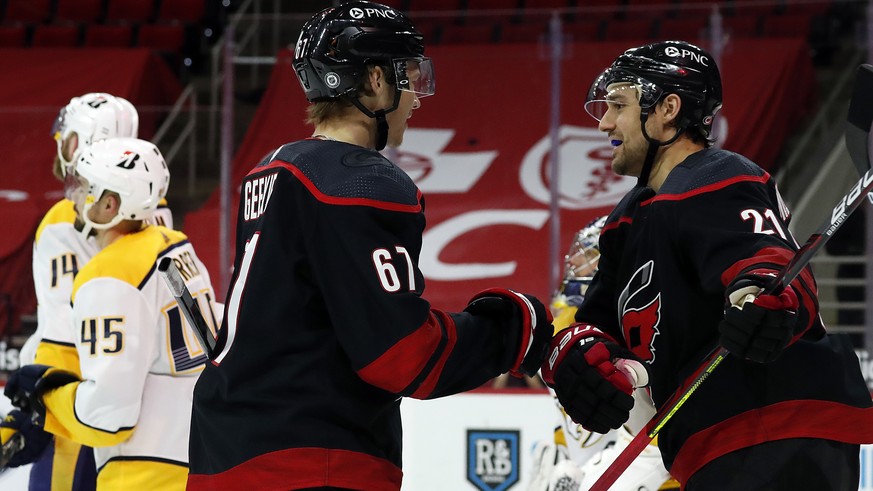 Carolina Hurricanes&#039; Morgan Geekie (67) is congratulated by Nino Niederreiter (21) after his second goal of the night, during the second period of the team&#039;s NHL hockey game against the Nash ...
