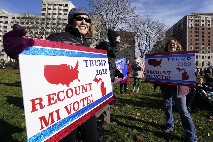 President Trump supporters rally at the Capitol building in Lansing, Mich., Saturday, Nov. 14, 2020. (AP Photo/Paul Sancya)