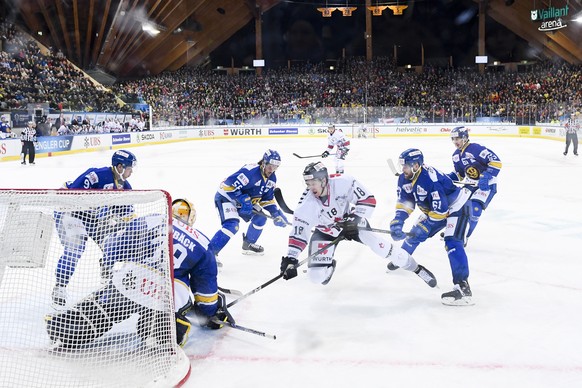 epa07249600 Team Canada&#039;s Zac Dalpe fights for the puck with Davos&#039;goalkeeper Anders Lindbaeck, during the game between HC Davos and Team Canada, at the 92nd Spengler Cup ice hockey tourname ...