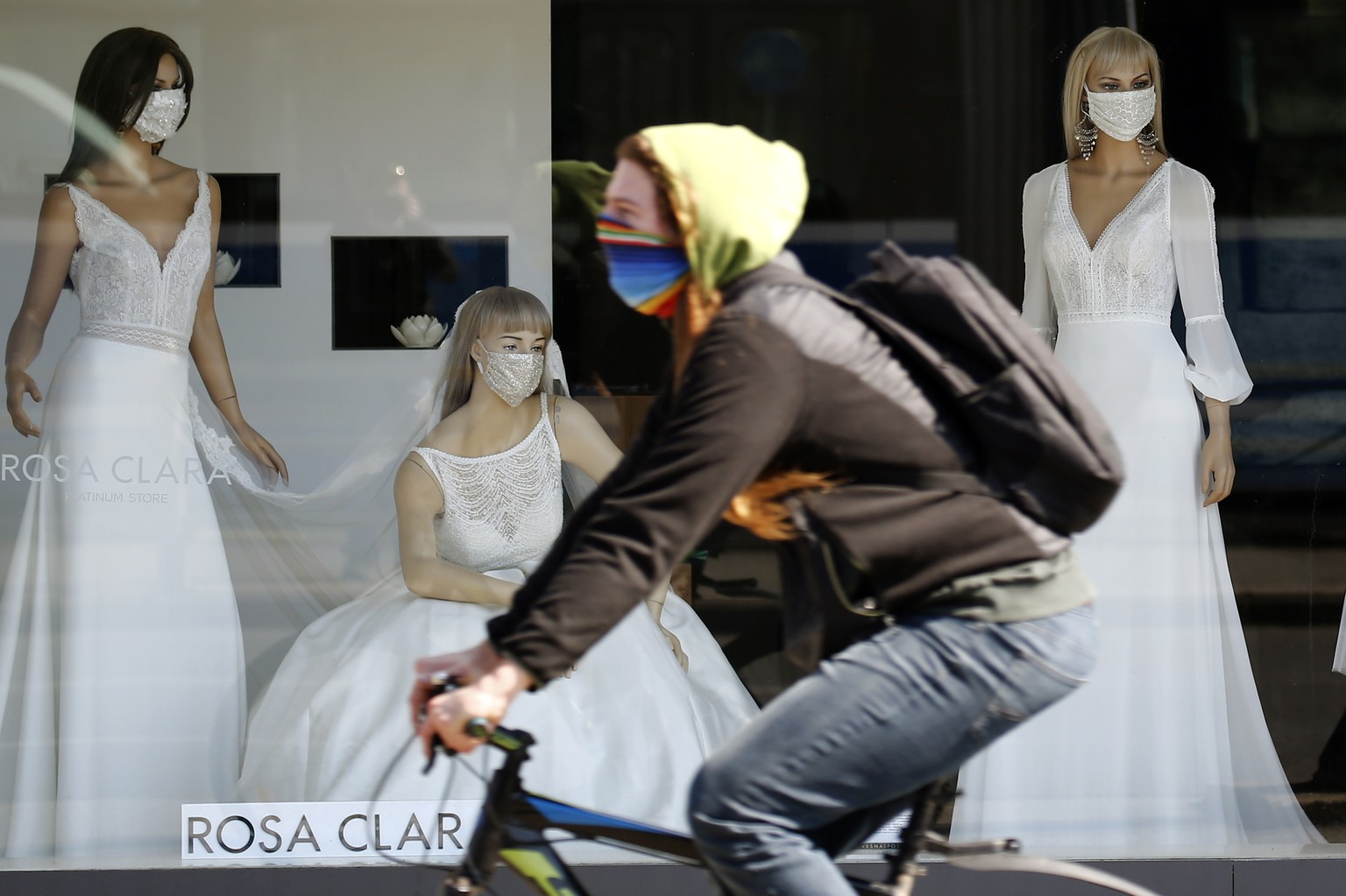 epa08297485 Mannequins dressed with face masks are displayed in the window of a wedding dress salon in Zagreb, Croatia, 16 March 2020. According to reports on 16 March 2020, Croatia has 49 confirmed c ...