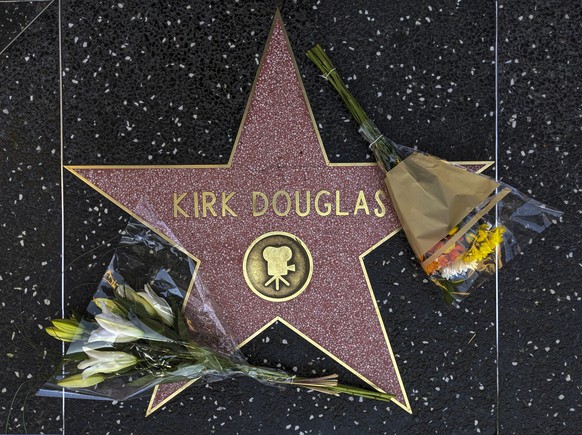 Flowers are placed on actor Kirk Douglas&#039; start on the Hollywood Walk of Fame in Los Angeles, Wednesday, Feb. 5, 2020. Douglas, the muscular actor with the dimpled chin who starred in &quot;Spart ...