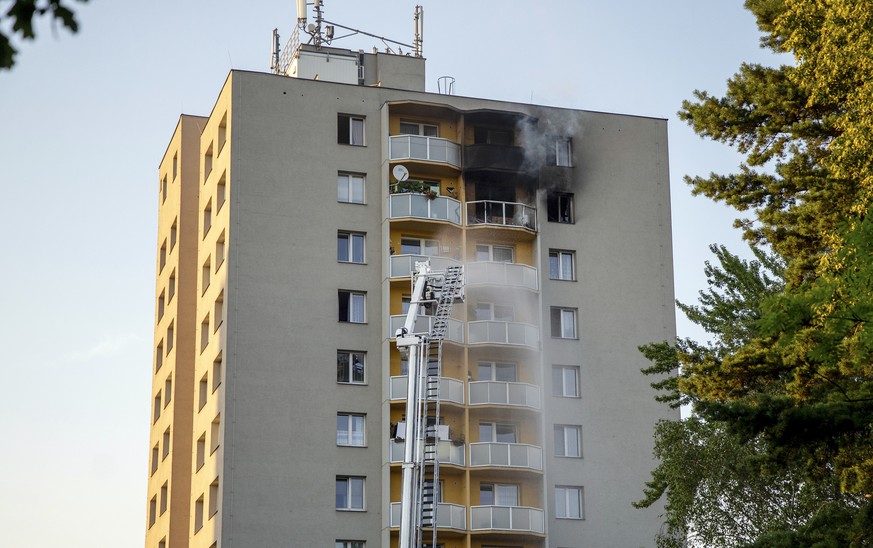 Firefighters battle a fire in an apartment building in Bohumin, northeastern Czech Republic, on Saturday, Aug. 8, 2020. At least 11 people have been killed in a fire in the apartment building police a ...