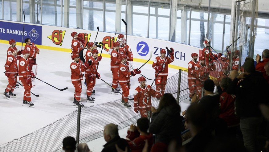 Lausanne&#039;s players great their supporters after winning against Pelicans during a shoutout session, at the Champions Hockey League game between Lausanne HC and Lathi Pelicans, at the ice stadium  ...