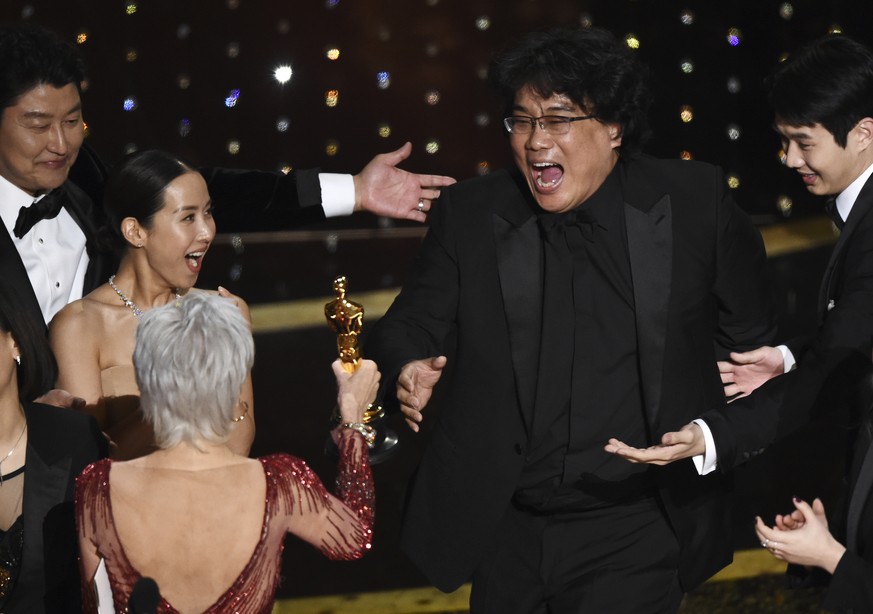 Bong Joon Ho, right, reacts as he is presented with the award for best picture for &quot;Parasite&quot; from presenter Jane Fonda at the Oscars on Sunday, Feb. 9, 2020, at the Dolby Theatre in Los Ang ...