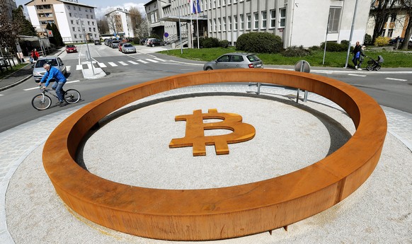 epa06661347 Traffic pass a roundabout with the allegedly world&#039;s first Bitcoin monument in Kranj, Slovenia, 11 April 2018. The forth largest city in Slovenia, Kranj, has in March inaugurated what ...