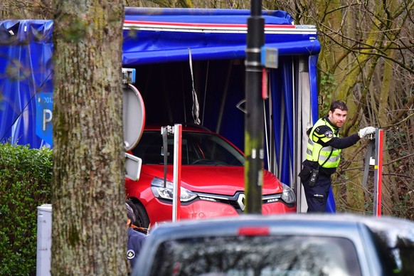 epa07447072 A car is found in the Tichelaarslaan in Utrecht, The Netherlands, 18 March 2019. Three people have been confirmed dead an several injured in a shooting on a tram in the central Dutch city  ...